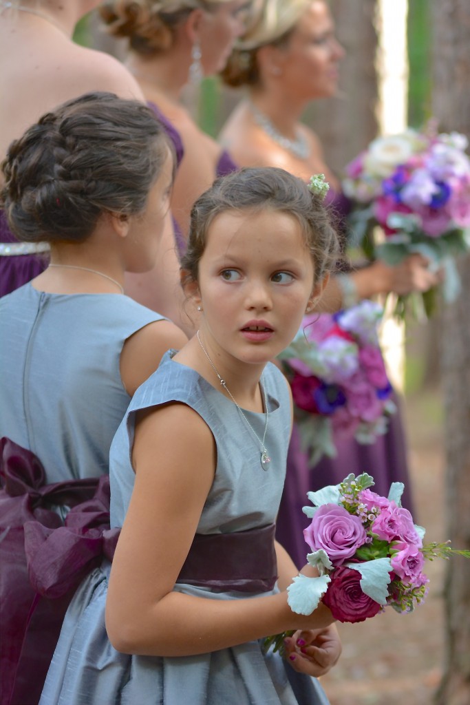 Reagan's sweet niece glancing back to see if her aunt was beginning her walk down the aisle...